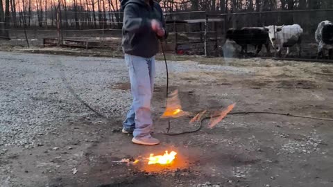 Guy Spins a Large Flaming Lasso