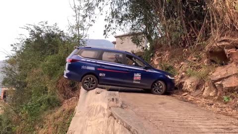 The expert driver demonstrates the very narrow road Uturn skills