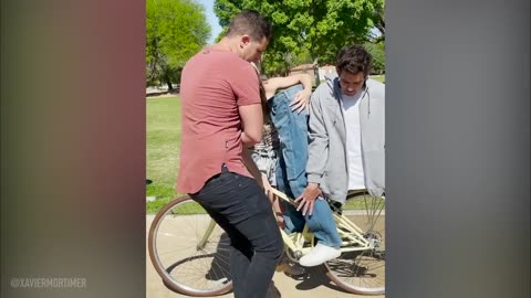 Man cut from centre in a half on bicycle magic