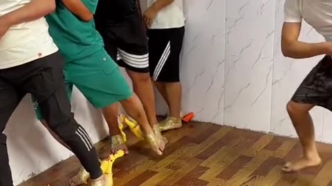 Blindfold Hitting Game With Duck Slippers