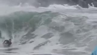 More Wild Surfing on the Hurricane with powerfull waves knocking people over.