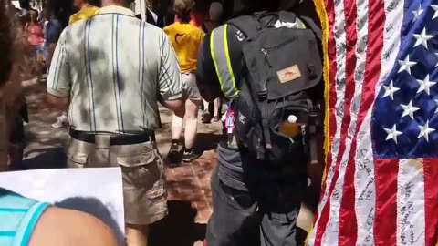 Aug 19 2017 Boston 1.1 Antifa carrying urine in bottle and a defaced American flag