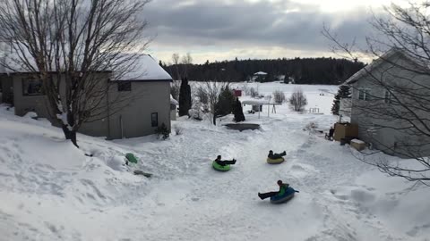 Tube Sledders Crisscross in the Air