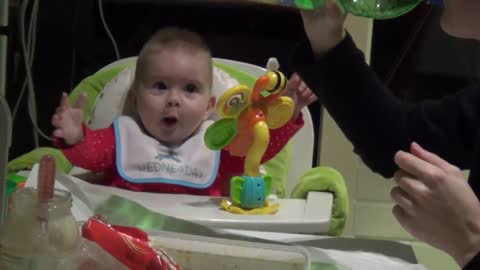 Baby's mind blown while watching mom drink