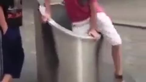 Kid gets trapped in the belly of a giant Swiss rubbish compactor 😳