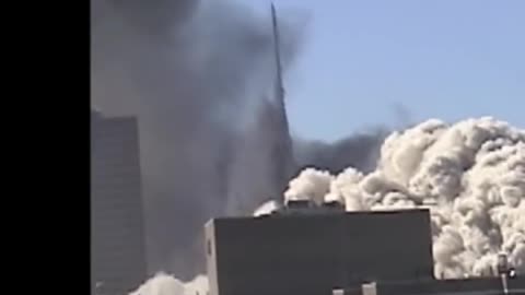 9/11 North Tower corner turns to dust mid-air