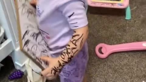 Little Girl Uses Marker And Scribbles On Herself And Things Around Her