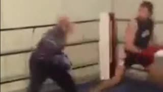 Young boxer is put at his place by an older more experienced boxer