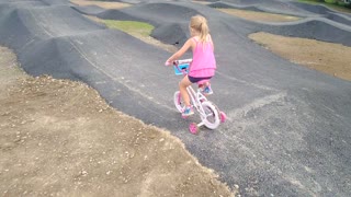 Girl on Bike with Training Wheels Fails at Pump Track