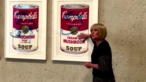 Climate activists glue themselves to Warhol work