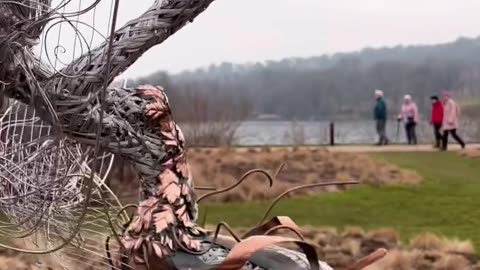 Dancing With Dandelions Is O’Clock Wish Is A Sculpture Depicting A Fairy Who Appears To Be Fighting The Wind While Holding A Dandelion