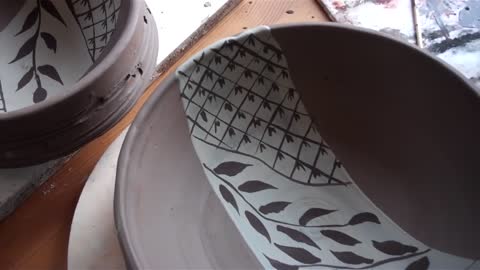 pottery brush decorating bowls, ready for oribe glazing