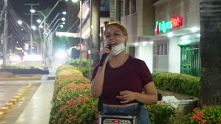 Venezolana singing in the street in Barranquilla Colombia