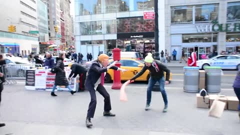 'Donald Trump' street performer lets New Yorkers beat him up