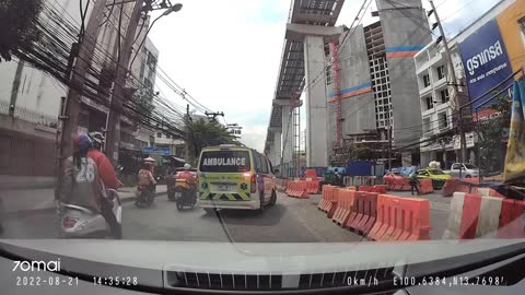 Motorcyclist Removes Barrier for Ambulance