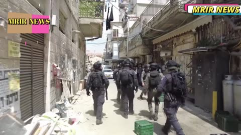 Israeli forces attempt to remove the Palestinian flag