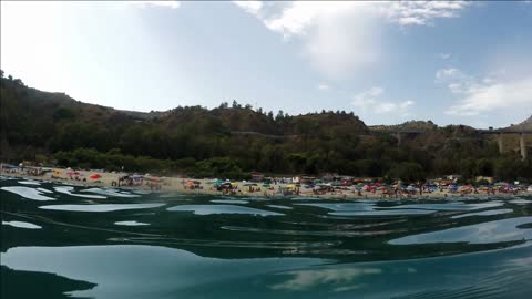water surface beach and people south italy real time