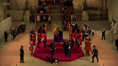 Royal guard at the Queen Elizabeth's coffin collapses