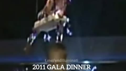 2011 GALA DINNER LONDON DEMON ON STAGE EATING SOMETHING