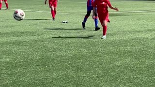 Soccer Player Takes Off Her Shoe to Land Kick