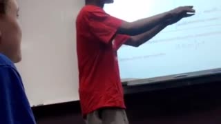 Man does failed back flip in classroom