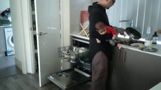 Loving dad does dishes while carrying son who does not like to be left alone - Tej