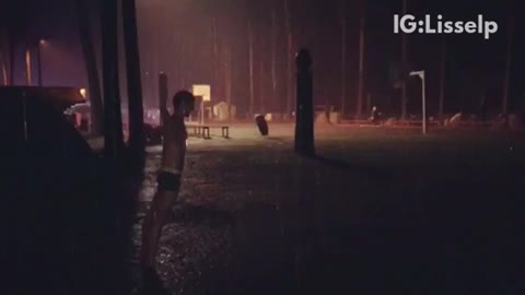 Guy in underwear falls in rain puddle and inchworms through it