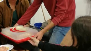Guy tries to leave red shirt drops cake door