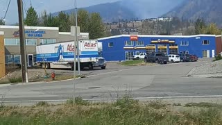 Big smoke plooms coming of the mountain near rose valley west kelowna view from the highway
