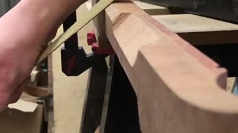 Shaping a guitar neck.