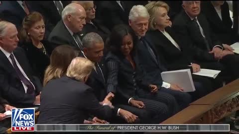 Michelle Obama shakes hands with Trump ay George HW Bush's funeral