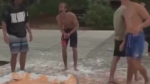 A group of young guys combined entertainment and science. The pool fluid is a non-Newtonian fluid.