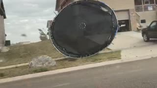 Trampoline Blowing in the Wind Hits Car