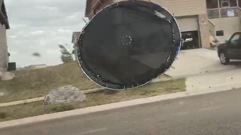 Trampoline Blowing in the Wind Hits Car