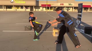 Cameron breaking a board with a kick