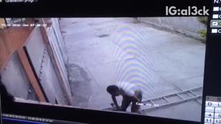Security footage man on ladder falls down