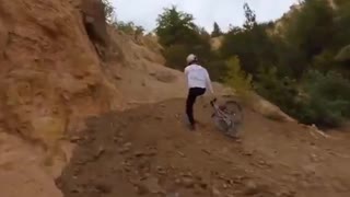 Mountain bike god doing his business