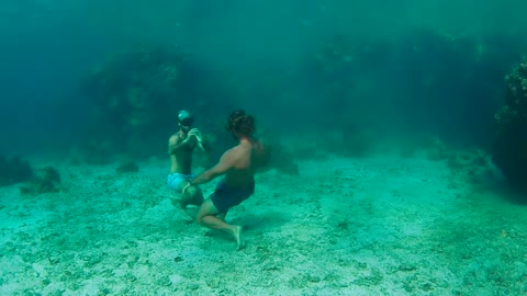Free Divers Hold Their Breath And Battle It Out Under Water