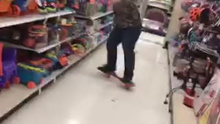 Guy in army sweater falls off red skateboard