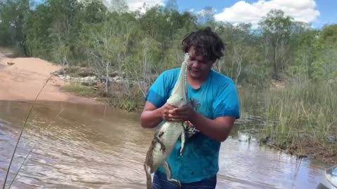 Man Catches Freshwater Crocodile with Bare Hands