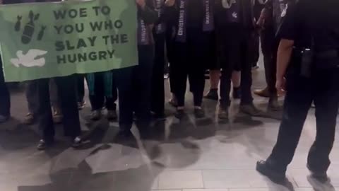 Protesters chant "ceasefire now" in the Senate Dirksen office cafeteria