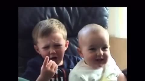 A small baby bite his elder brother