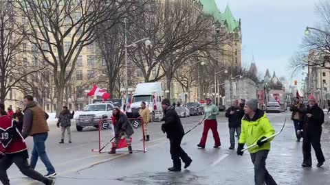 Truckers have gathered in the blockaded streets of downtown Ottawa to play a game of hockey