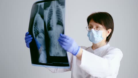Female Doctor Looking at an X-Ray
