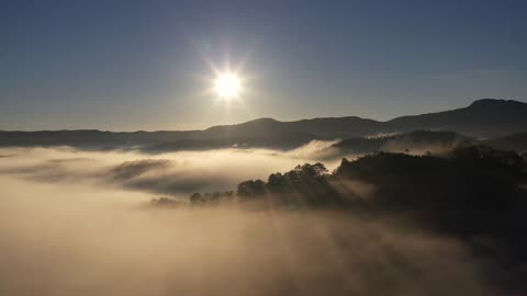 Mountains fog clouds sunset