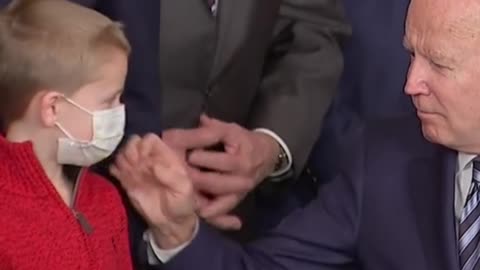 Biden chats with child during bill signing