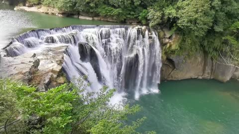 Waterfalls cascading through multi layer of rocks formation