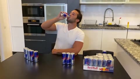 Tristan Tate breaks the Guinness World Record for most cans of Red Bull consumed in 3 minutes