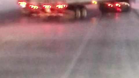 Wind Whips Trailer into Passing Truck
