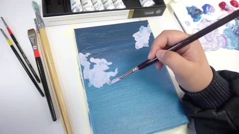 Drawing clouds with acrylic paint